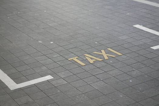Taxi parking spot marked on city street pavement photo