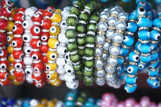 Colorful beaded bracelets showcased at a local market photo