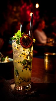 Refreshing Passion Fruit Cocktail in a dimly lit bar setting. photo