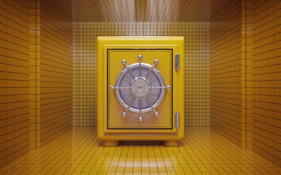 A yellow safe in a room with a door photo