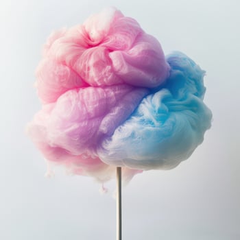 A cotton candy on a stick with a white background photo