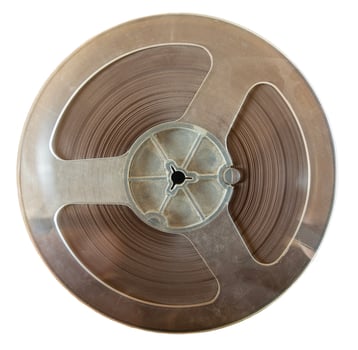 reel of tape for reel-to-reel tape recorder from 1970s in USSR, isolate on white background photo