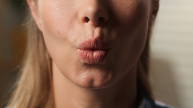 Cropped macro view close up unrecognizable Caucasian woman saying wow excited amazing news reaction astonish girl female lips mouth surprise half face indoors at home kissing lip kiss balm lipstick photo