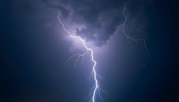 lectric Bolts Flashing Through Cloudy Night Sky photo