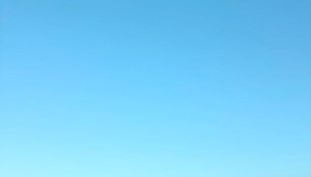 Bright Blue Sky With No Clouds Visible photo
