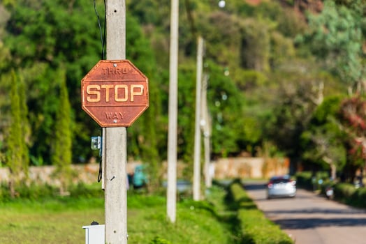 Old vintage retro style rusty metal traffic stop sign for traffic concept. photo