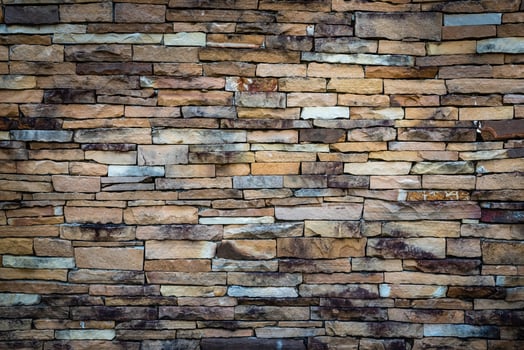 Old vintage retro style bricks wall for abstract brick and stone work background and texture. photo