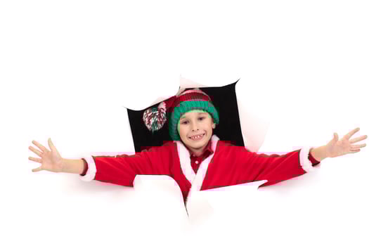 Child Santa Claus looks out of a hole in paper. Holiday surprise. Christmas holiday concept photo