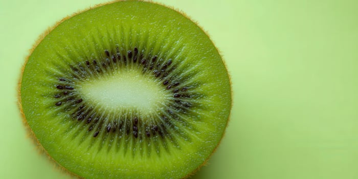 A vibrant close-up shot captures a juicy kiwi slice with rich green color and texture. photo