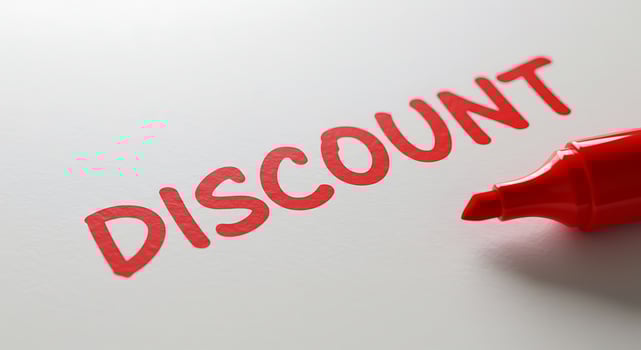 Discount word on white paper with red marker photo