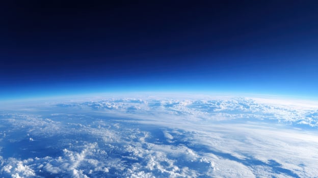 Panoramic view from high altitude showcasing the Earth's curvature, atmospheric layers and cloud formations. photo