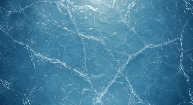 A blue marble surface with a light shining through it photo