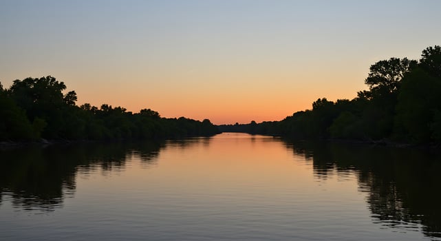 A calm river at sunset photo
