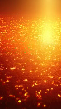 A bright orange glow over a shiny surface photo