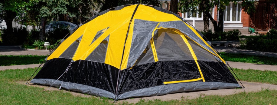 A tent with a yellow and black color photo