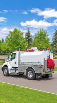 A white truck with a hose on it photo