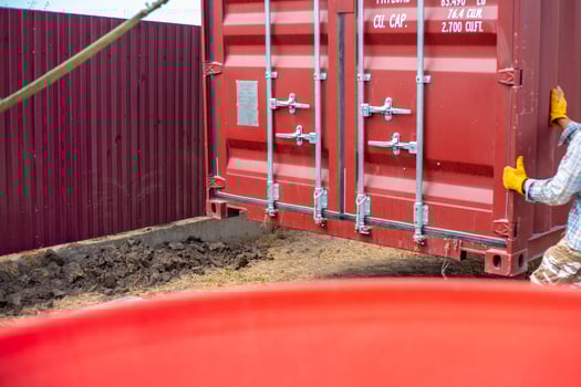 On the site unloading a cargo container onto a cargo platform photo