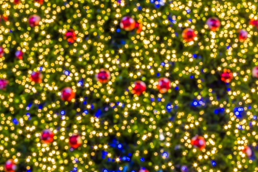 A christmas tree with many colorful balls photo