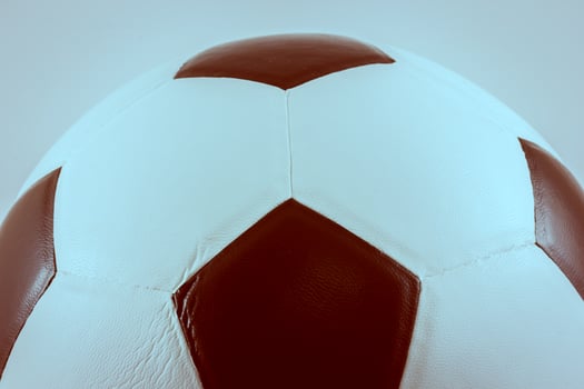A soccer ball with a white and brown design photo