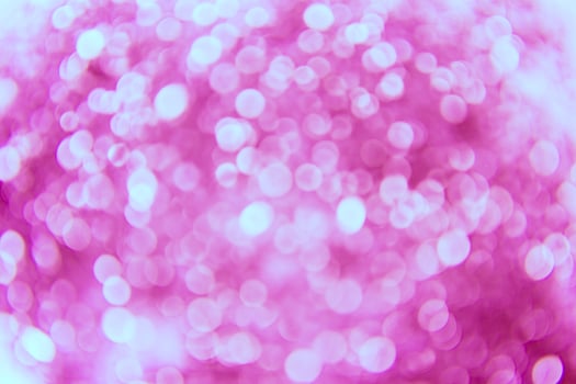 A pink background with many small circles photo