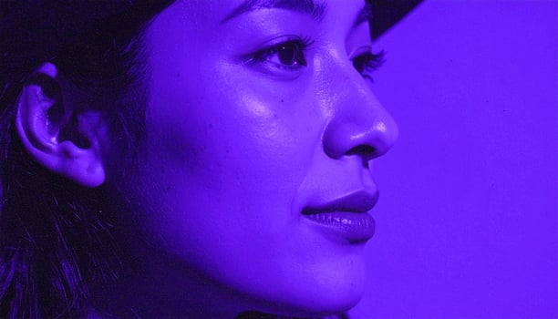 Serene Profile Portrait Illuminated by a Dreamy, Electric Purple Haze photo