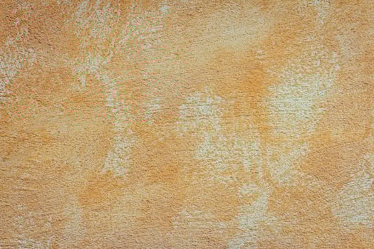 A close up of a wall with a brown paint photo