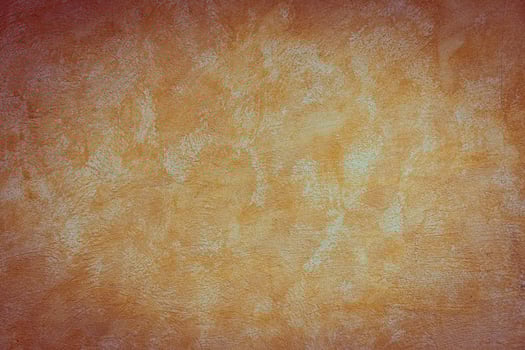 An orange painted wall with a red background photo