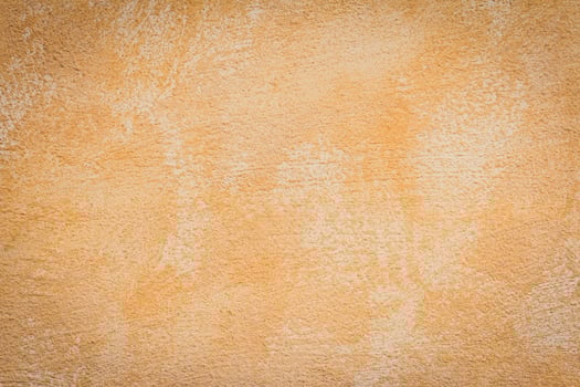 A brown and tan wall with a paint texture photo