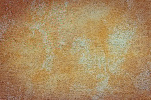 An orange wall with a brown paint photo