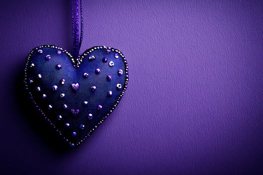 Decorative Fabric Heart with Rhinestones Hanging Against a Purple Background. This image is perfect for Valentine's Day, romantic designs, or any project needing a touch of elegance. photo