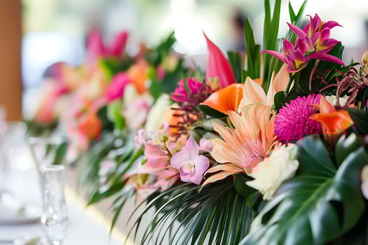 Vibrant Tropical Flower Arrangement for Wedding or Event Decor. A close-up showcasing a colorful display of exotic blooms. photo