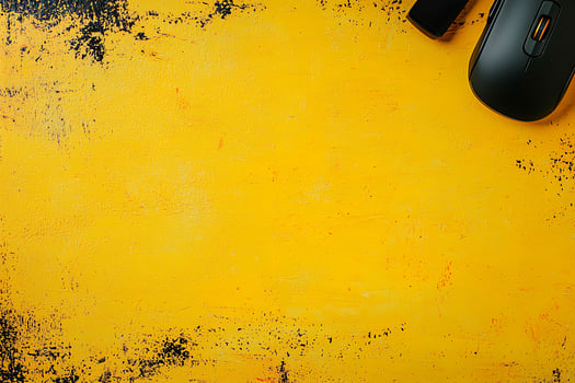 Vibrant Yellow Background with Computer Mouse and USB Drive. A cheerful, minimalist workspace image perfect for technology or productivity themes. photo