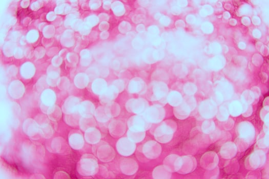A pink and white background with a lot of white circles photo