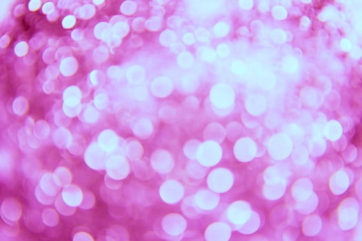 A pink background with many small lights photo