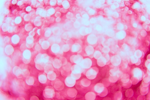 A pink background with many small white lights photo
