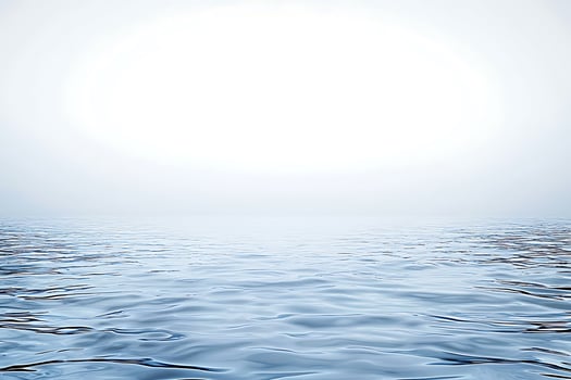 Serene Water Surface A Tranquil Image of Gentle Waves and a Bright Horizon. photo