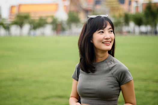 Happy solo southeast asian woman teenager blogger enjoying world travel tourism concept. local cultural explorer experience in Bangkok Thailand asia photo