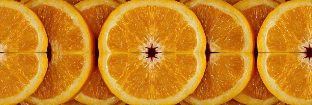Sliced Oranges Arranged in Mandala Design With Motion Blur Creating a Symmetrical Visual Effect photo