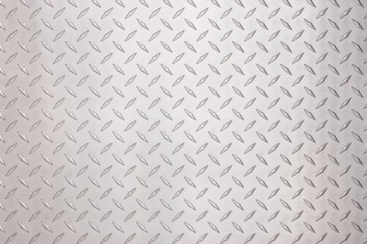 metallic steel plate with diamond pattern. light silver metal background photo