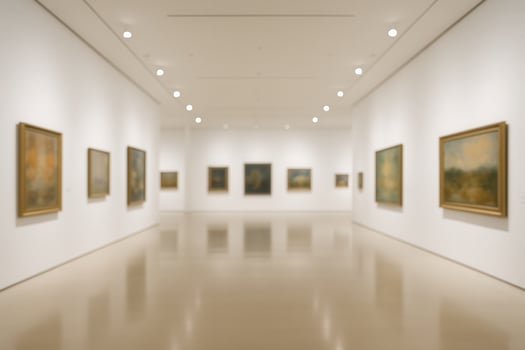 Spacious Art Gallery Interior Featuring Modern Paintings on White Walls with Soft Lighting Enhancing the Minimalist Design and Elegant Ambiance for Art Exhibition Visitors photo
