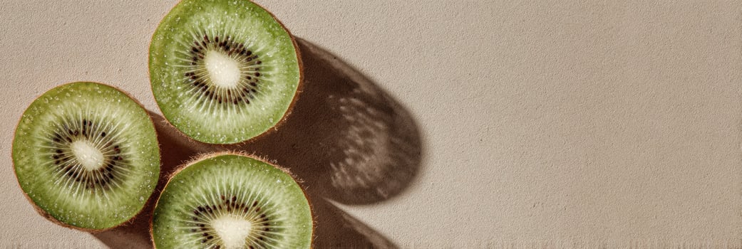 Halves of Fresh Kiwi Floating on a Neutral Canvas Creating a Minimalist and Serene Visual Display photo