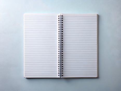 Blank Lined Notebook Open on Pale Blue Textured Background photo