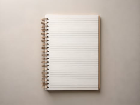 Blank White Spiral Notebook on Beige Background photo