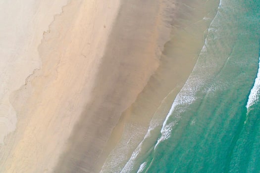Top Down View of a Tropical Beach with Turquoise Water, aerial drone top down view zenithal photo