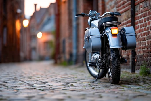 A motorcycle parked on a cobblestone street photo