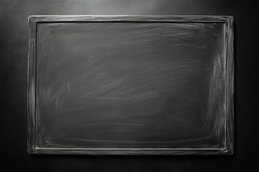 The grey chalkboard presents a blank surface ready for creative writing or drawing, perfect for classrooms or personal use photo