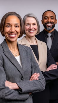 Three diverse professionals standing confidently together photo