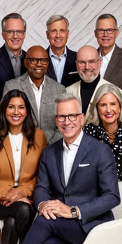 Group of diverse professionals poses for a formal portrait photo