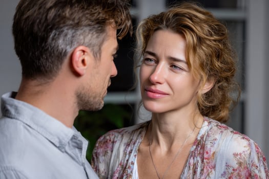 A man and woman are looking at each other photo