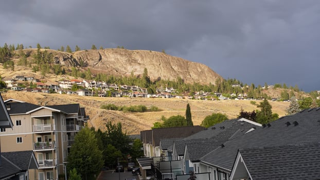 a view of the mountains and houses in the background photo